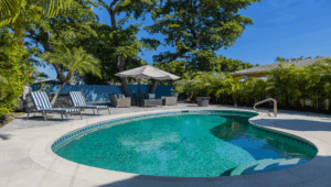 backyard-modern-house-with-swimming-pool-artificial-grass-stone-path-trees-chairs-fotor-202511050340